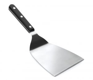 Spatule coudée pour grille